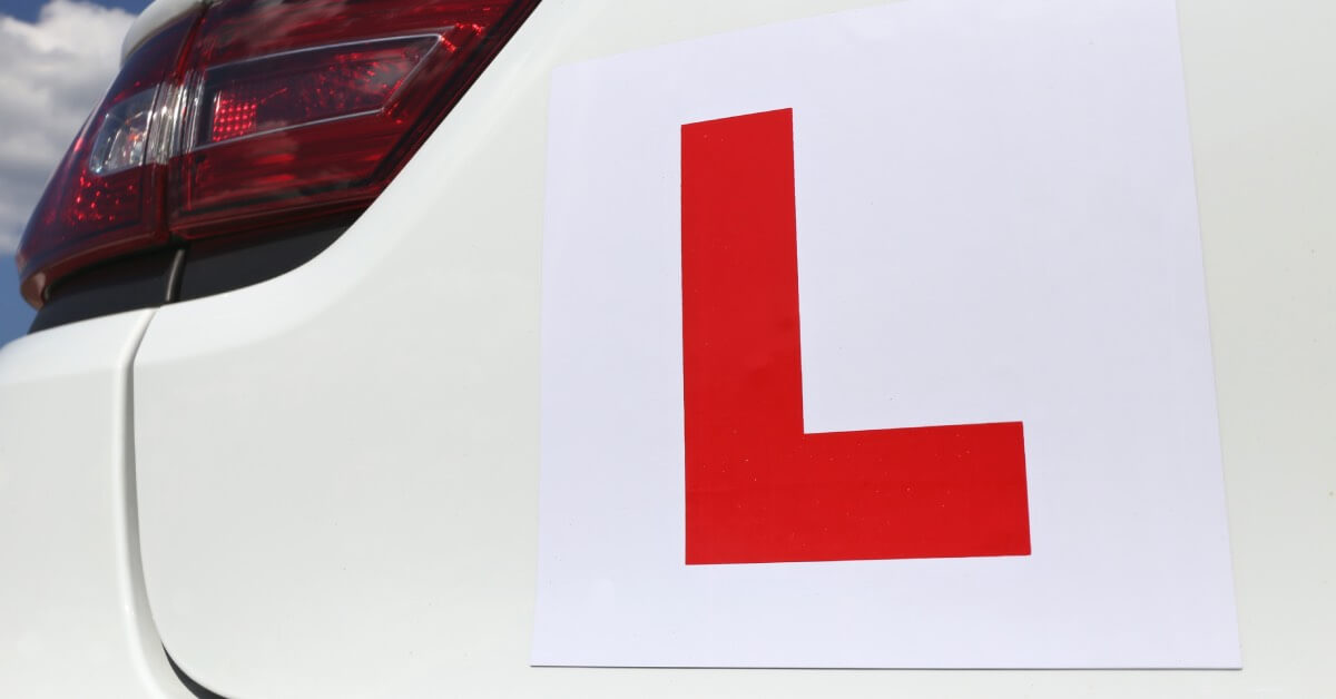 L-plate sticker on the back of a car