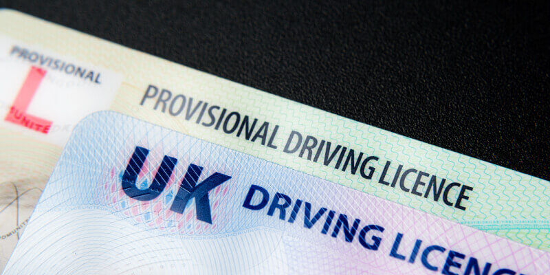 UK driving licence placed on top of UK provisional licence